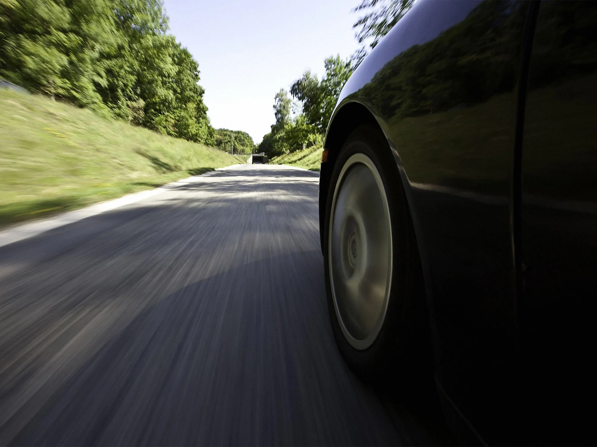 Car Driving on a Road Causing Unusual Vibrations - Wheel Balancing Service | Point S · Pneus et Mécanique Sainte-Catherine